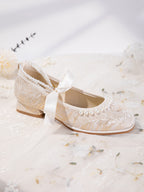 Mary Jane flats with pearl ankle strap detail in natural light