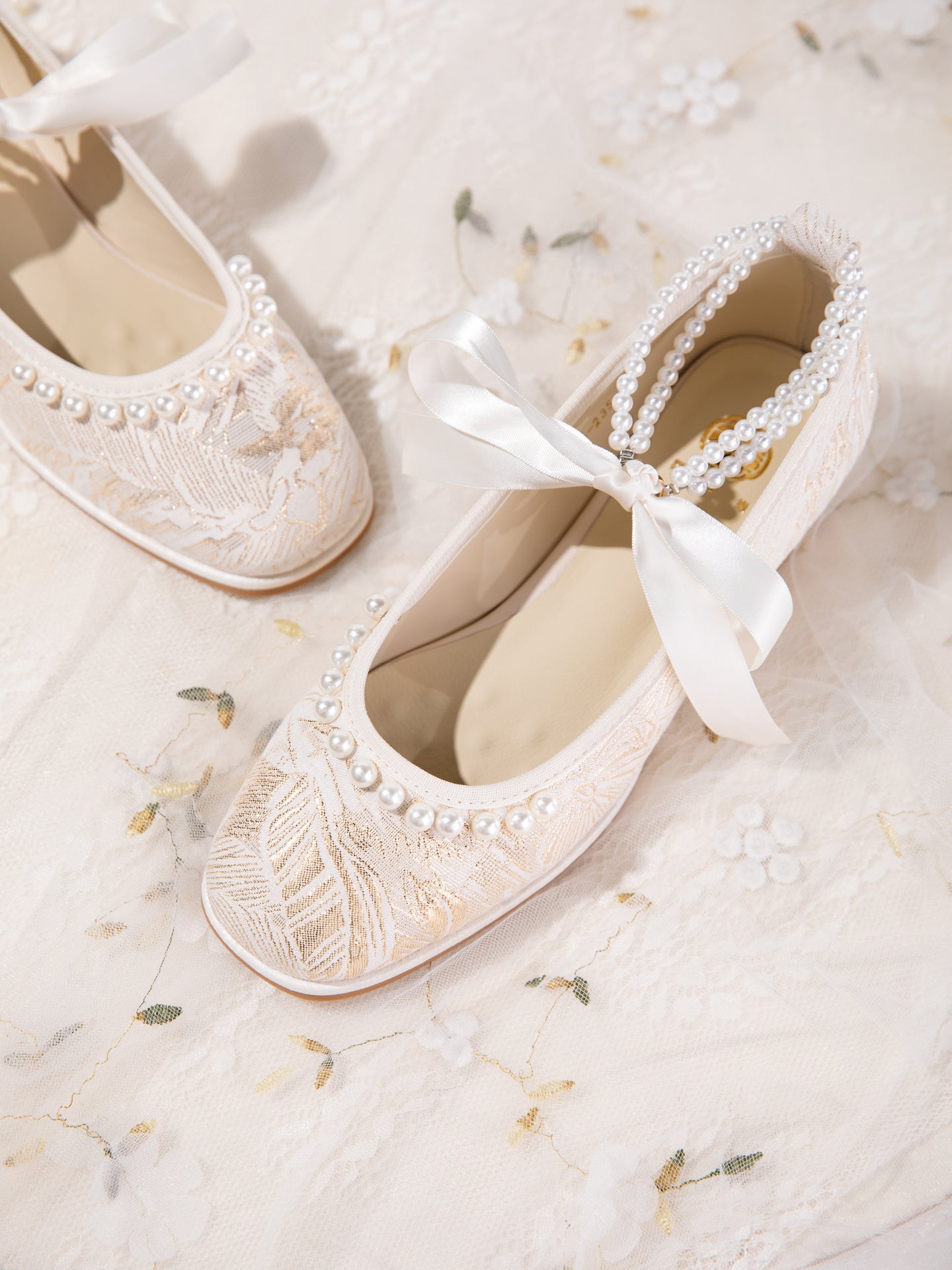 Jacquard floral pattern and satin bow detail close-up